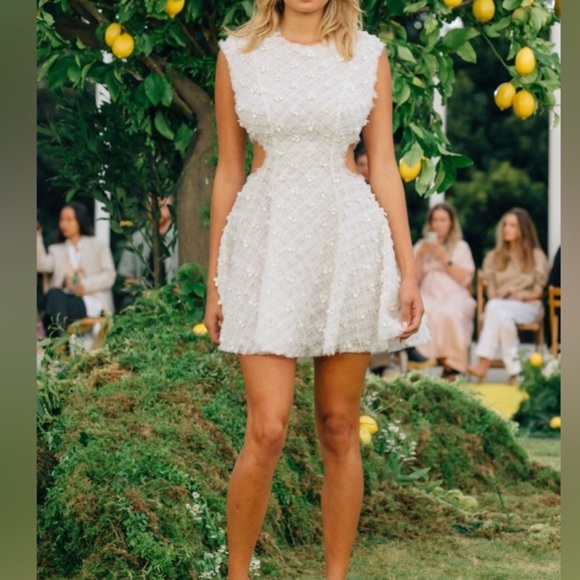 Stunning ivory white open cutting out with delicate flowers cute detailing. - Picture 9 of 16